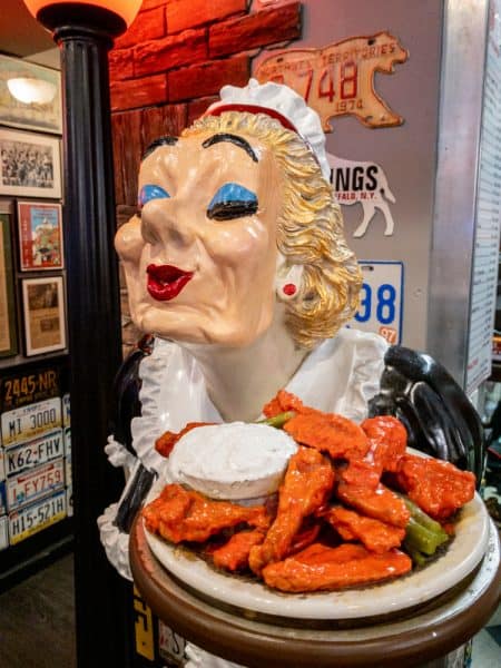 Lady with Buffalo Wings at Anchor Bar in Buffalo, NY