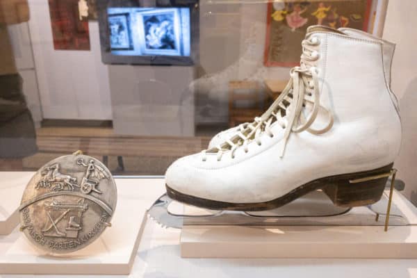 Olympic medal and figure skates at the Lake Placid Olympic Museum in New York