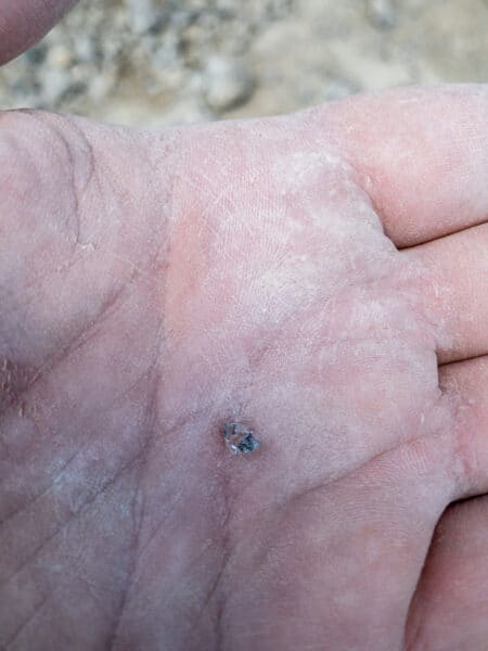 Hand holding a Herkimer Diamond