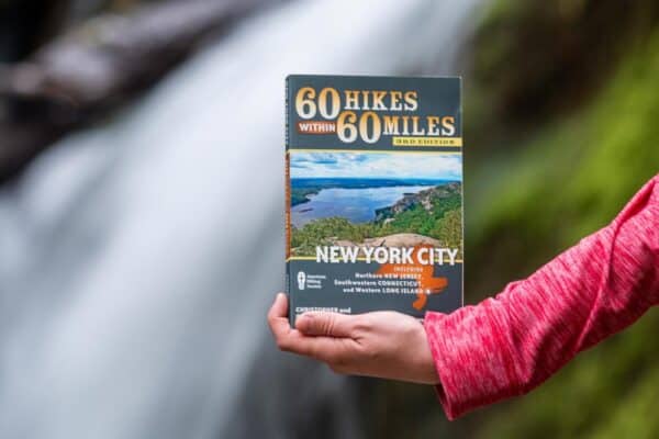 Woman holding New York Hiking Books