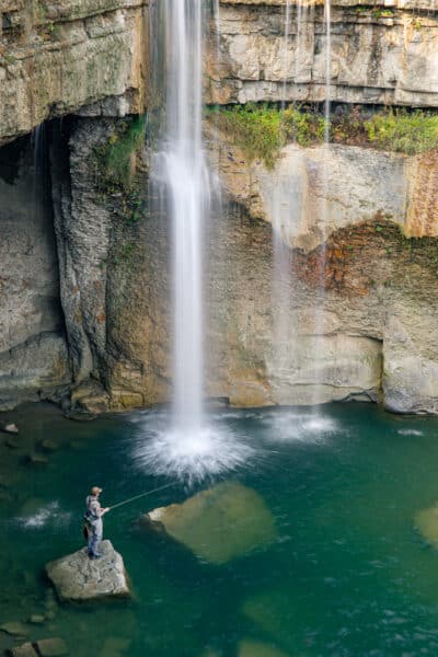 Man fishing at Ludlowville Falls in the Finger Lakes