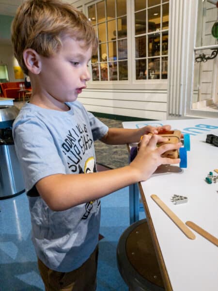 Boy playing at the Rochester Museum and Science Center in New York