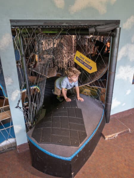 Young boy playing at the Adventure Zone at the Rochester Museum and Science Center in Rochester New York