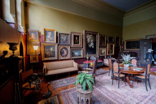 Dining room filled with paintings inside Olana State Historic Site in New York.