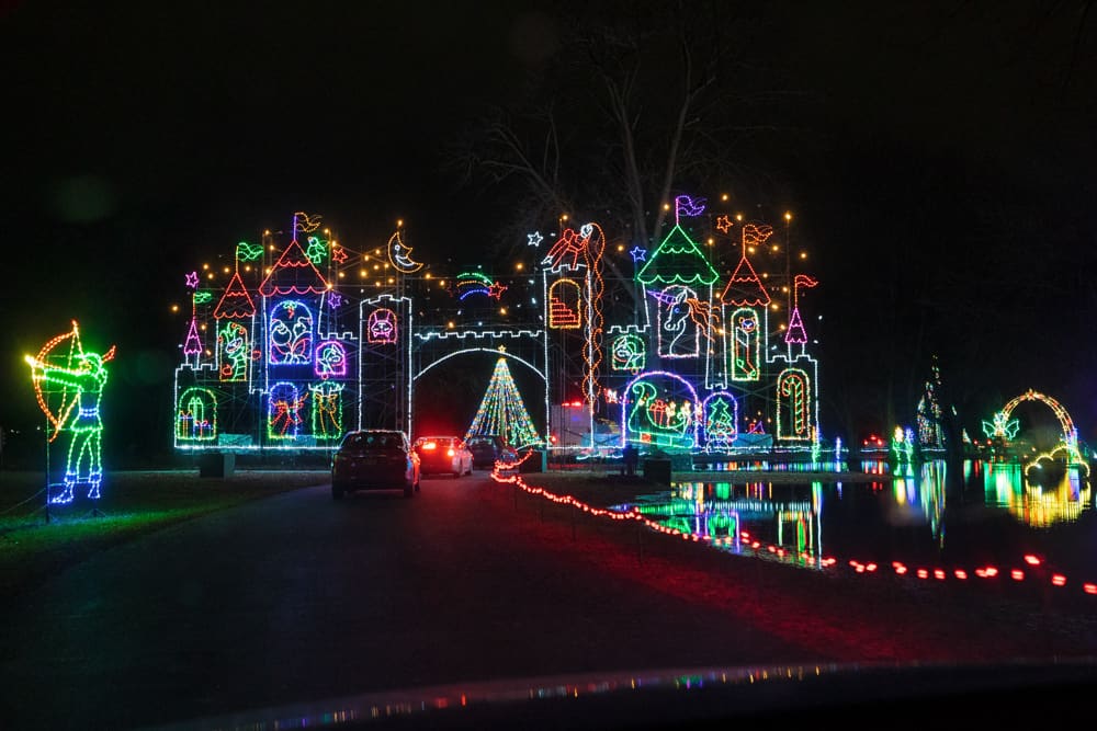 Driving through a lit castle at Lights on the Lake in Syracuse NY