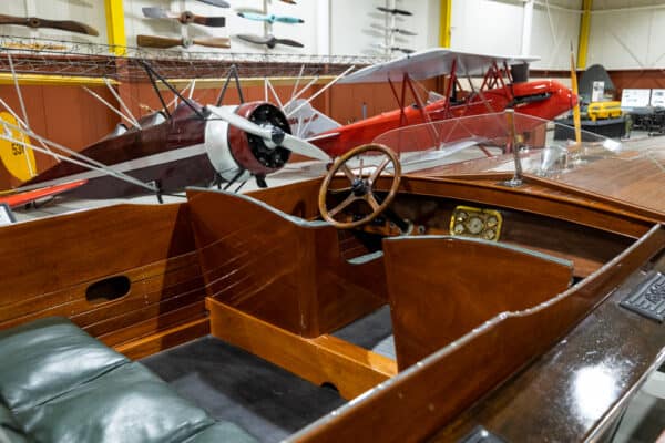 Antique wooden boat and airplanes at the Glenn H Curtiss Museum in New York