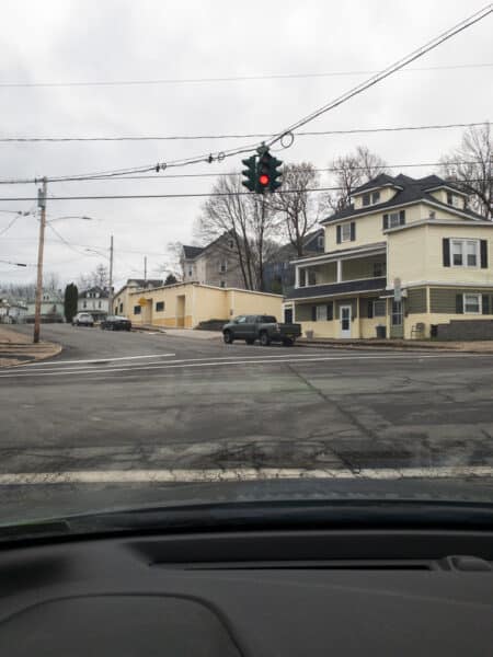 View of the Green-Over-Red Traffic Light in Syracuse from inside a car