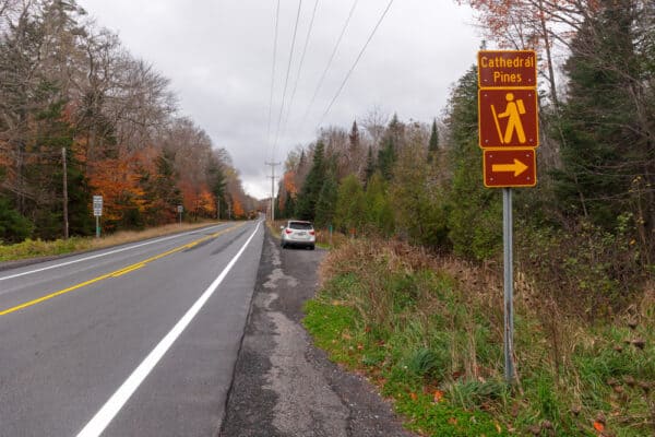 Car parked along the road for the Cathedral Pines Trail in the Adirondacks