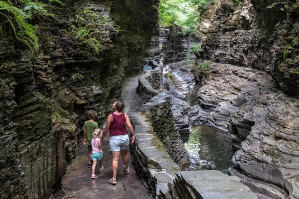 Women and children hiking through the Gorge Trail at Watkins Glen State Park in the Finger Lakes.