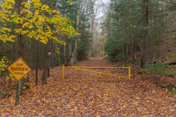 Yellow gated hiking trail to Death Brook Falls near Raquette Lake NY