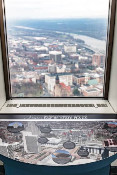 Information sign in front of window at the observation deck at the Corning Tower in Albany New York