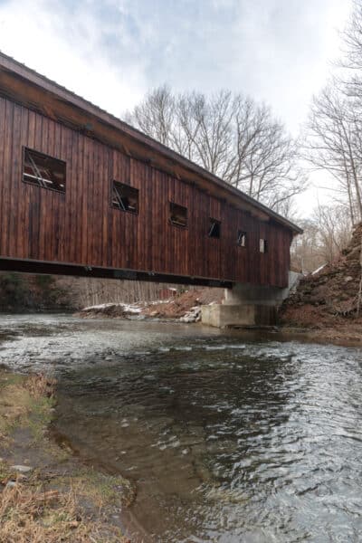Side view of Cayuga Creek running under Cannon Covered Bridge near Cowlesville, New York