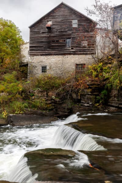 Fox Creek Falls drops in front of a historic building in Albany County NY
