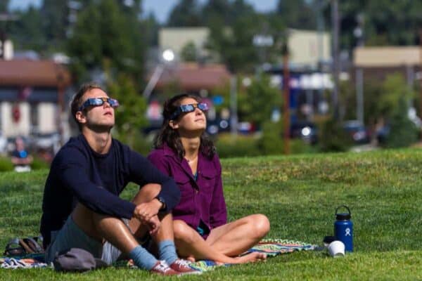 People watching an eclipse (Stock Photo)