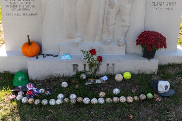 Baseballs and other items at the base of Babe Ruth's grave in Westchester County, NY