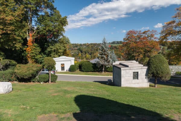 Grass and trees seen from the grave of Babe Ruth in Gate of Heaven Cemetery in Westchester County New York