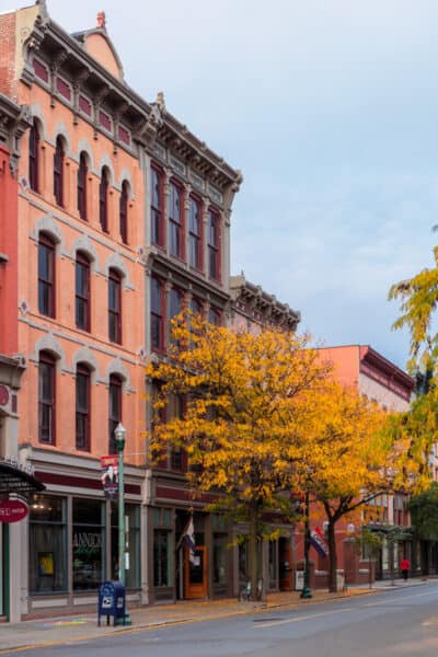 Historic buildings in downtown Troy New York with fall colors on the trees