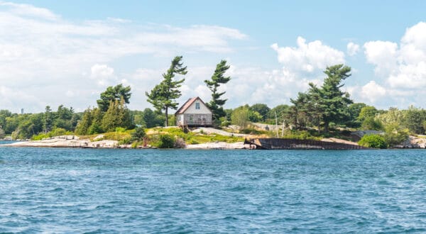 A house on an island in the middle of the St. Lawrence River in New York