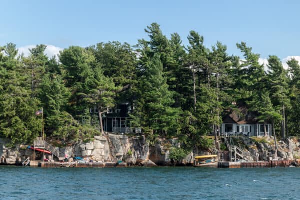 Pine tree covered island in the St. Lawrence River as seen from a Clayton Island Boat Tour in New York