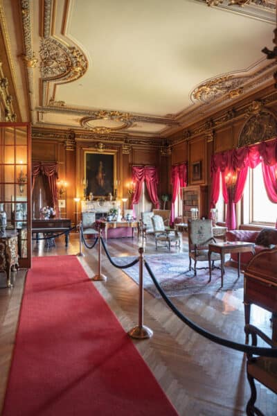 A large red parlor at Staatsburgh State Historic Site in the Hudson Valley of New York.