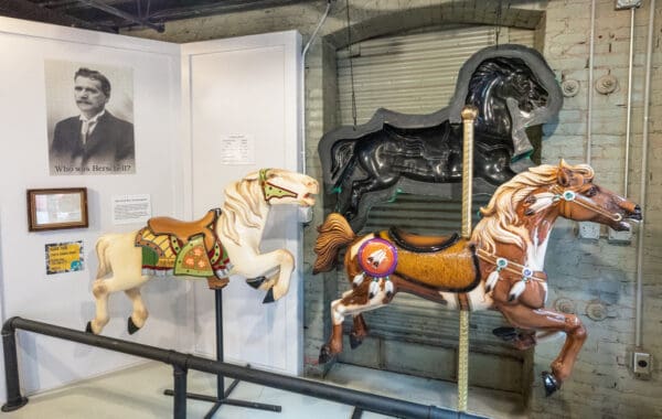 Historic wooden carousel horses on display at the Herschell Carrousel Factory Museum in North Tonawanda, New York