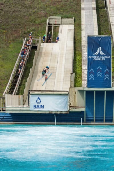 An aerialist about to jump into a pool at the Olympic Ski Jumping Center in Lake Placid, New York