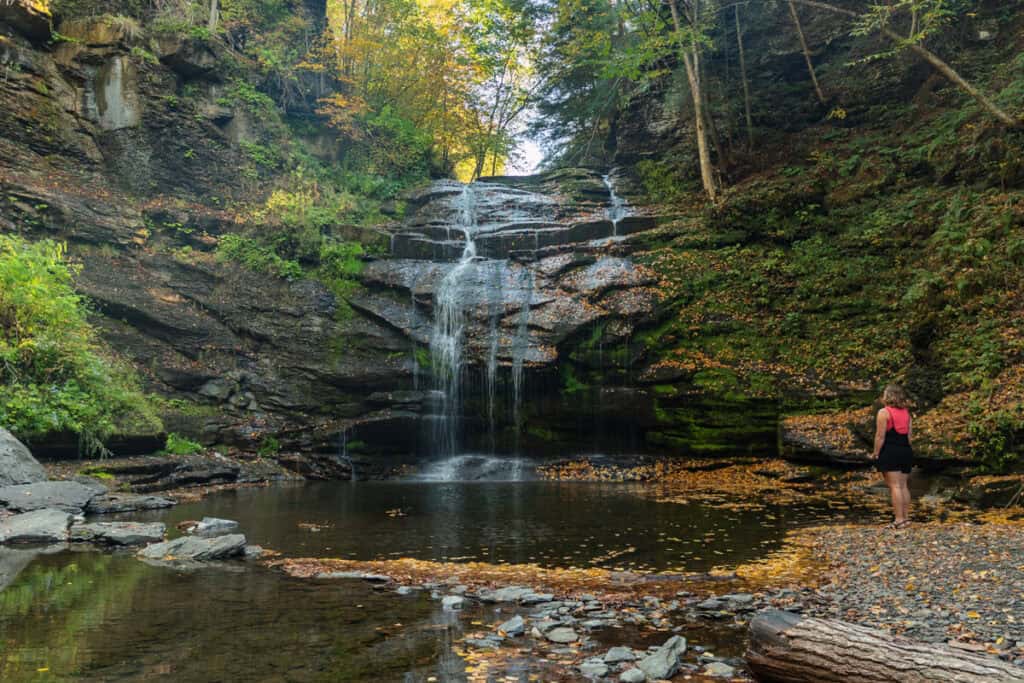 Woman Standing in front of Rexford Falls in Sherburne NY